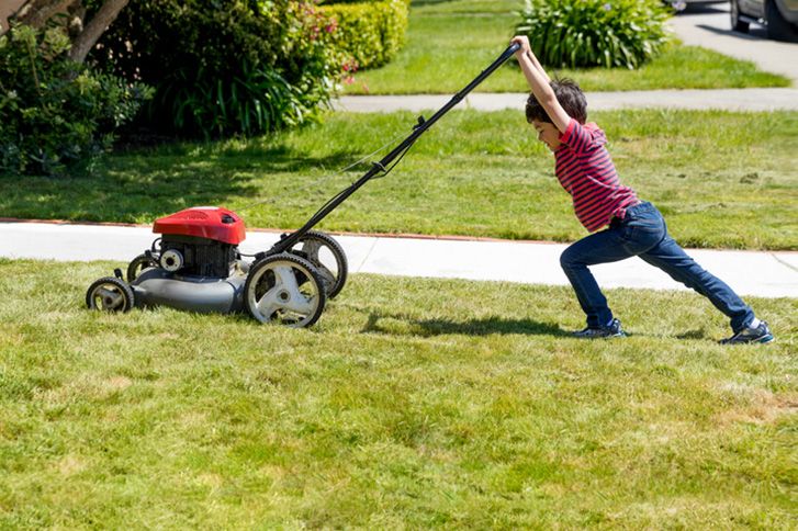 Tulsa Lawn Care | Kid Mowing Grass